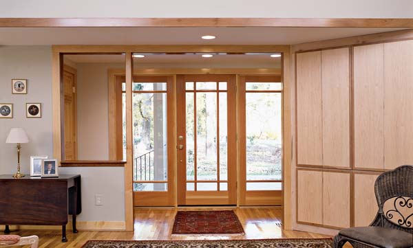 AFTER: Lowering the ceiling height inside the door and adding human-scaled detail creates a more welcoming entry and helps differentiate it from the main living spaces.